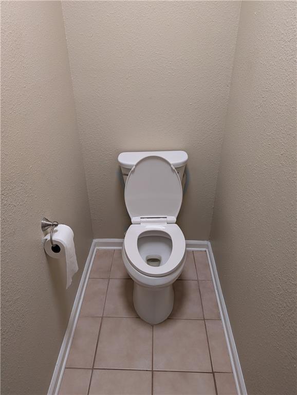 608 Eagle Dr, Slidell, LA 70461 - bathroom with tile patterned floors, baseboards, and toilet