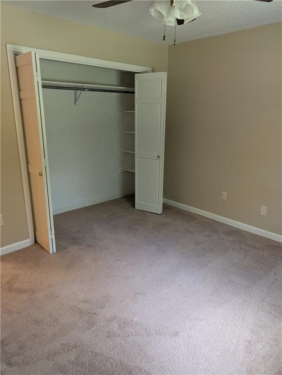 608 Eagle Dr, Slidell, LA 70461 - unfurnished bedroom featuring light colored carpet, a closet, and ceiling fan