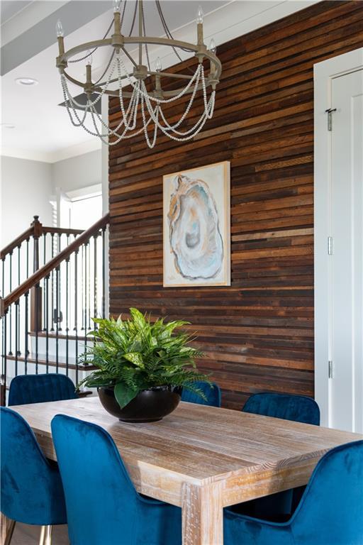 415 N Dupre St, New Orleans, LA 70119 - dining room with a chandelier, wooden walls, ornamental molding, and recessed lighting