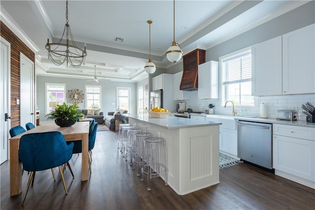 415 N Dupre St, New Orleans, LA 70119 - kitchen with appliances with stainless steel finishes, a sink, dark wood finished floors, decorative backsplash, and crown molding