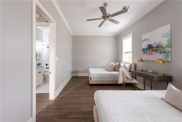 415 N Dupre St, New Orleans, LA 70119 - bedroom with crown molding, dark wood-style floors, baseboards, ceiling fan, and connected bathroom