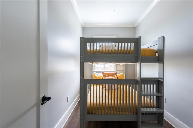 415 N Dupre St, New Orleans, LA 70119 - bedroom featuring ornamental molding, baseboards, and wood finished floors