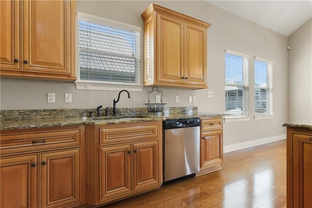 4027 Borneo St, Bay Saint Louis, MS 39520 - kitchen featuring dishwasher, a sink, plenty of natural light, and baseboards