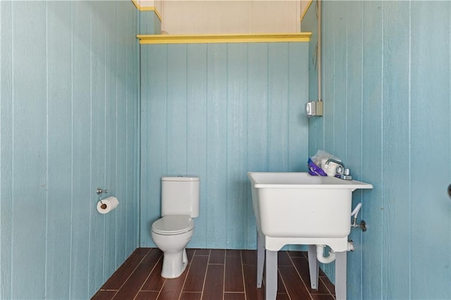 4027 Borneo St, Bay Saint Louis, MS 39520 - half bathroom featuring wood tiled floors and toilet