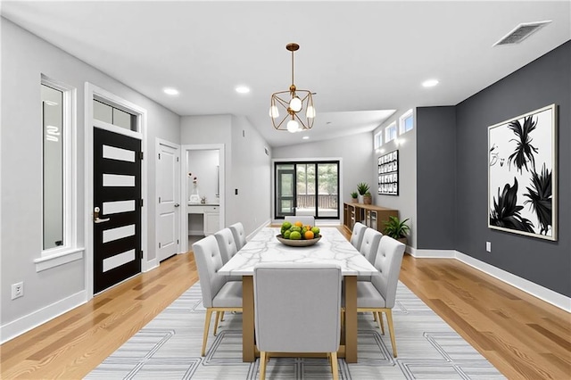 6100 Duplessis St, New Orleans, LA 70122 - dining room featuring baseboards, a chandelier, light wood finished floors, and recessed lighting