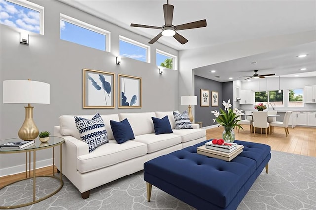6100 Duplessis St, New Orleans, LA 70122 - living area featuring a ceiling fan, light wood-style floors, healthy amount of natural light, baseboards, and recessed lighting