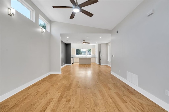 6100 Duplessis St, New Orleans, LA 70122 - unfurnished living room featuring a ceiling fan, lofted ceiling, light wood finished floors, baseboards, and recessed lighting