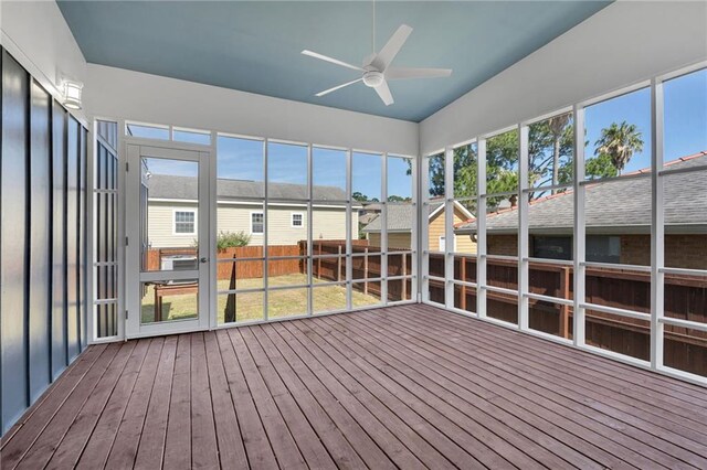 6100 Duplessis St, New Orleans, LA 70122 - unfurnished sunroom with ceiling fan, vaulted ceiling, and a residential view
