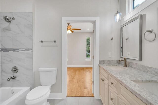 6100 Duplessis St, New Orleans, LA 70122 - full bathroom with toilet, double vanity, ceiling fan, baseboards, and shower / bathtub combination