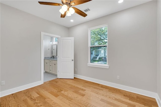 6100 Duplessis St, New Orleans, LA 70122 - unfurnished bedroom featuring light wood-style flooring, baseboards, ensuite bathroom, recessed lighting, and a sink