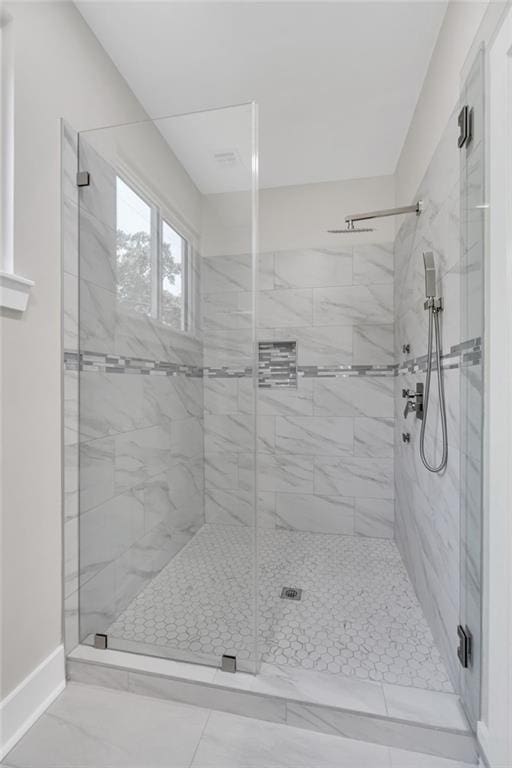 6100 Duplessis St, New Orleans, LA 70122 - full bathroom featuring a stall shower and baseboards