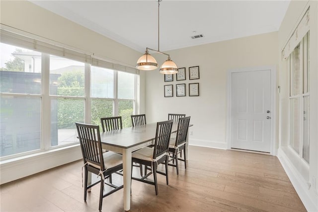 8 Ani St, New Orleans, LA 70124 - dining space with wood finished floors, baseboards, and ornamental molding