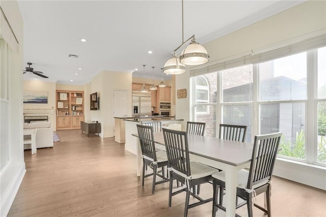 8 Ani St, New Orleans, LA 70124 - dining area featuring crown molding, light wood-style floors, a ceiling fan, recessed lighting, and baseboards