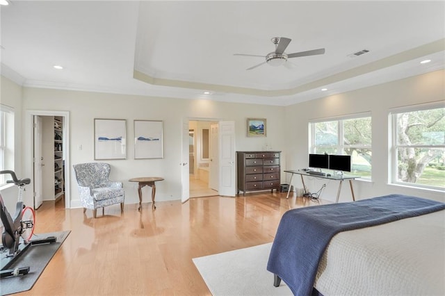 8 Ani St, New Orleans, LA 70124 - bedroom featuring a tray ceiling, ornamental molding, light wood-type flooring, a spacious closet, and an office area