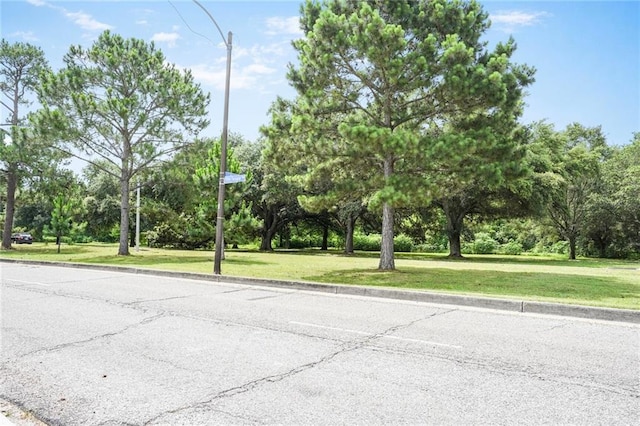 8 Ani St, New Orleans, LA 70124 - view of asphalt street with curbs and view of scattered trees