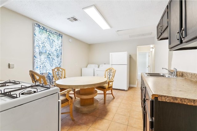3309 4th St, New Orleans, LA 70125 - dining room with washer / clothes dryer and light tile patterned flooring