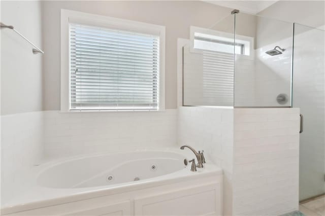 1112 Safflower Ct, Madisonville, LA 70447 - full bathroom featuring a stall shower, a tub with jets, and healthy amount of natural light