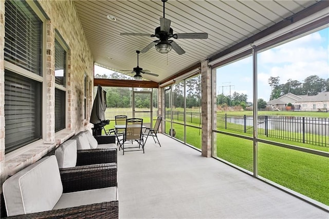 1112 Safflower Ct, Madisonville, LA 70447 - sunroom / solarium with a water view, ceiling fan, lofted ceiling, and outdoor dining area