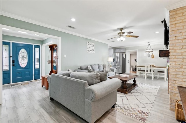 9 Osborne Ave, Kenner, LA 70065 - living area featuring ceiling fan, crown molding, recessed lighting, and light wood finished floors