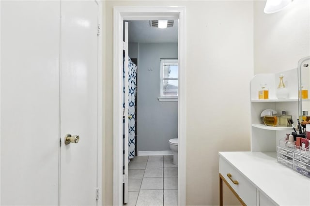 9 Osborne Ave, Kenner, LA 70065 - bathroom with toilet, tile patterned floors, and curtained shower