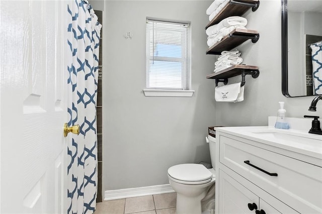 9 Osborne Ave, Kenner, LA 70065 - full bath with tile patterned flooring, vanity, toilet, baseboards, and a shower with curtain