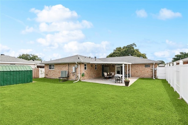 9 Osborne Ave, Kenner, LA 70065 - rear view of property with a patio area, brick siding, and central AC