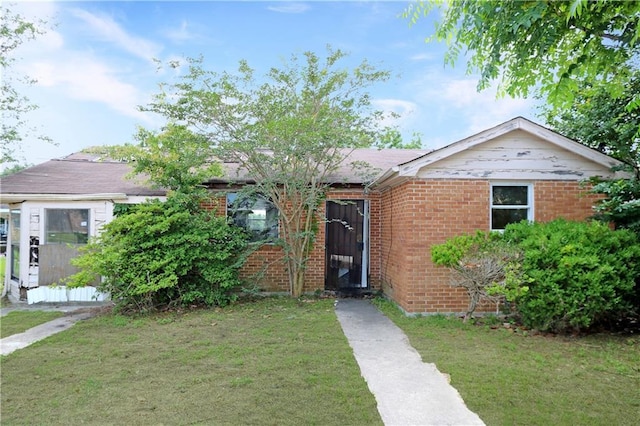 8018 Mackenzie St, New Orleans, LA 70128 - ranch-style house featuring a front lawn and brick siding