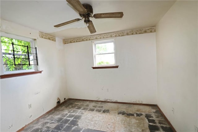 8018 Mackenzie St, New Orleans, LA 70128 - empty room featuring a ceiling fan and baseboards