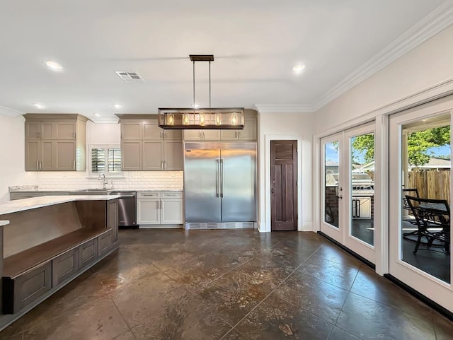 9125 5th St, River Ridge, LA 70123 - kitchen with stainless steel appliances, crown molding, light countertops, gray cabinetry, and tasteful backsplash