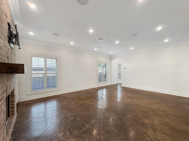 9125 5th St, River Ridge, LA 70123 - unfurnished living room with a brick fireplace, arched walkways, ornamental molding, recessed lighting, and baseboards