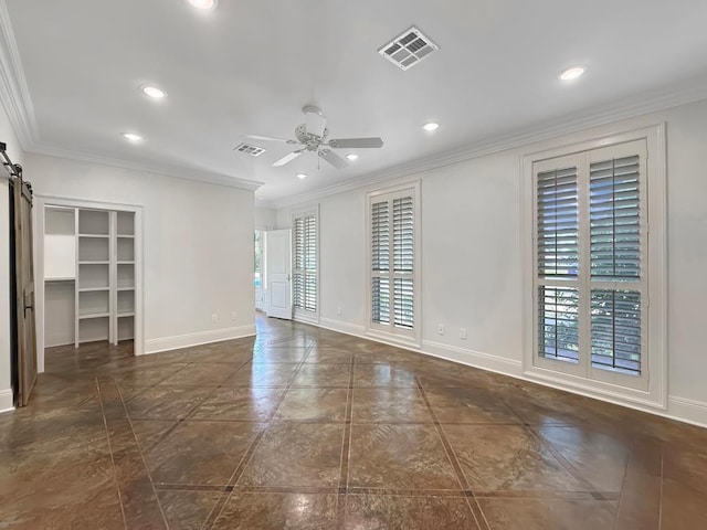 9125 5th St, River Ridge, LA 70123 - unfurnished room featuring a barn door, recessed lighting, a ceiling fan, baseboards, and crown molding