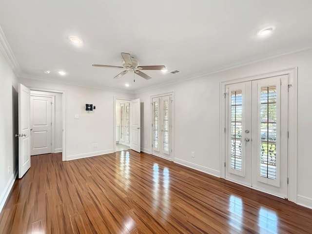 9125 5th St, River Ridge, LA 70123 - empty room with a ceiling fan, healthy amount of natural light, wood finished floors, ornamental molding, and recessed lighting