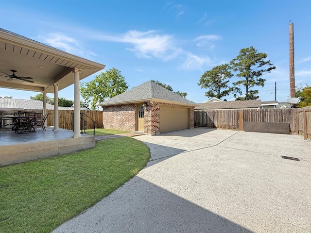 9125 5th St, River Ridge, LA 70123 - view of side of property with brick siding, ceiling fan, roof with shingles, and a garage