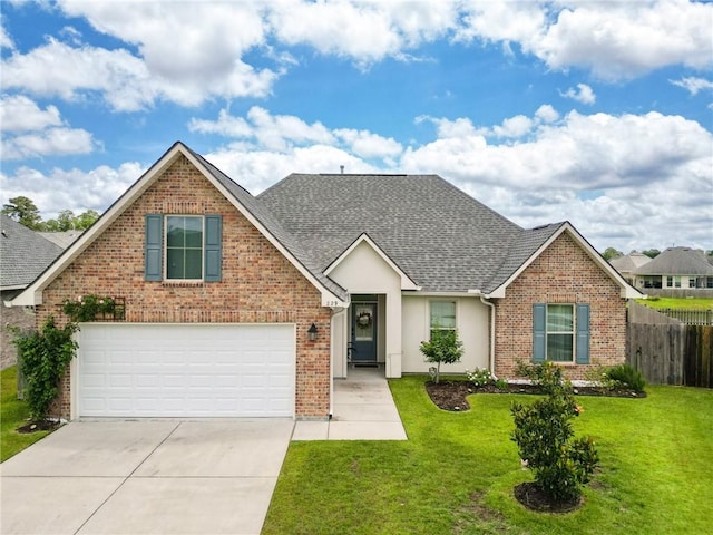 229 Louisiana Iris Cir, Slidell, LA 70458 - traditional home with roof with shingles, concrete driveway, brick siding, and a garage
