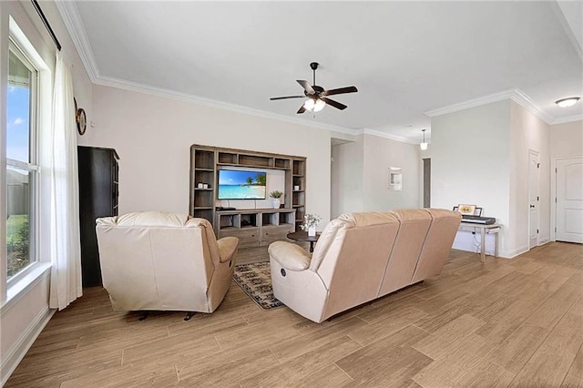 229 Louisiana Iris Cir, Slidell, LA 70458 - living area featuring a ceiling fan, light wood-style flooring, baseboards, and crown molding