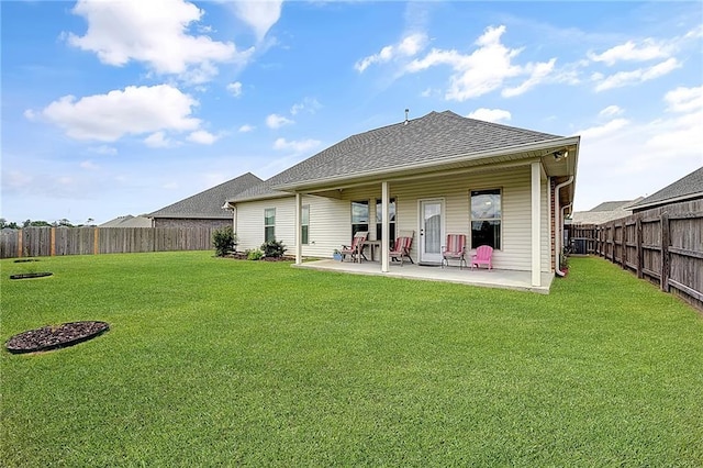 229 Louisiana Iris Cir, Slidell, LA 70458 - back of property featuring a patio and a shingled roof
