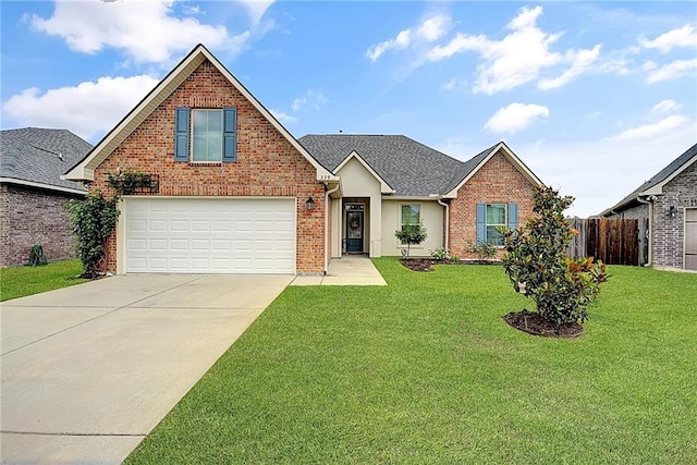 229 Louisiana Iris Cir, Slidell, LA 70458 - traditional-style home with driveway, brick siding, an attached garage, and a shingled roof
