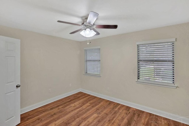 314 E Pineridge St Unit 314, Mandeville, LA 70448 - spare room with baseboards, wood finished floors, and ceiling fan