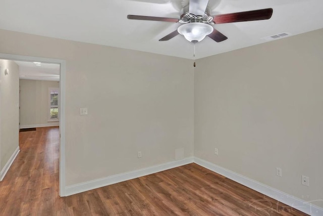 314 E Pineridge St Unit 314, Mandeville, LA 70448 - spare room with wood finished floors, a ceiling fan, and baseboards
