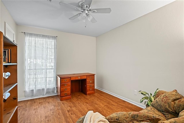 1532 Broadmoor Dr, Slidell, LA 70458 - home office featuring ceiling fan, light wood-type flooring, and baseboards