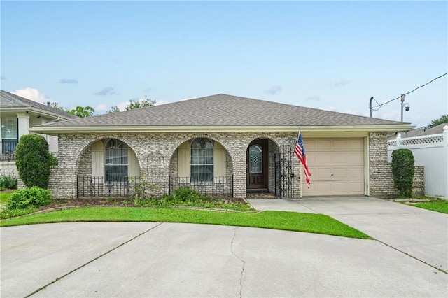 4744 Fairfield St, Metairie, LA 70006 - view of front of property featuring an attached garage, a porch, driveway, and brick siding