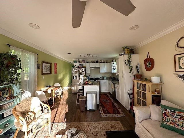 921 Andry St, New Orleans, LA 70117 - living area featuring dark wood-style flooring, a ceiling fan, and crown molding