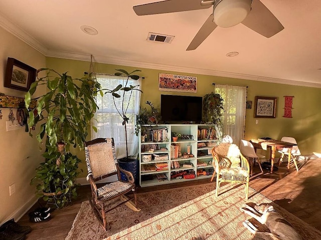 921 Andry St, New Orleans, LA 70117 - living area featuring ornamental molding, wood finished floors, a ceiling fan, and baseboards