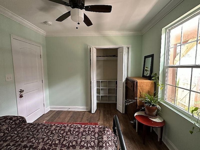 921 Andry St, New Orleans, LA 70117 - bedroom featuring dark wood-type flooring, baseboards, a ceiling fan, ornamental molding, and a closet