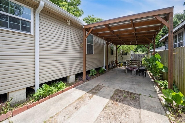 921 Andry St, New Orleans, LA 70117 - view of parking with a carport and driveway