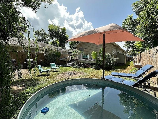 921 Andry St, New Orleans, LA 70117 - view of swimming pool featuring a wooden deck and a fenced backyard