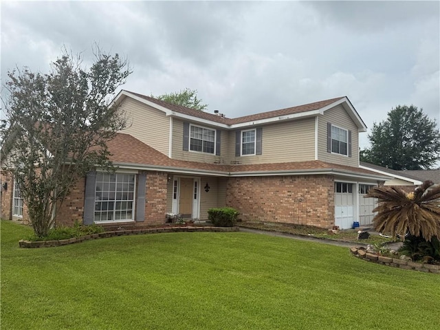 112 Cedarwood Dr, Slidell, LA 70461 - traditional-style house featuring an attached garage, brick siding, a front yard, and roof with shingles