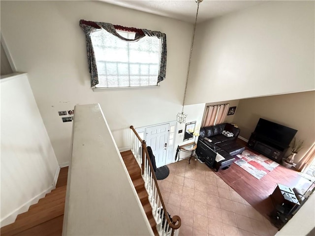 112 Cedarwood Dr, Slidell, LA 70461 - tiled living room featuring baseboards and stairs