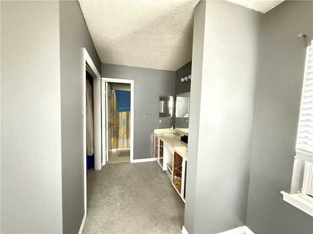 112 Cedarwood Dr, Slidell, LA 70461 - bathroom with baseboards, a textured ceiling, and vanity