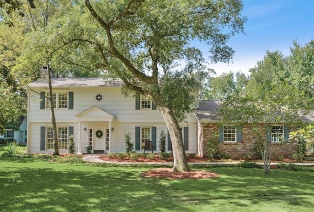 42 Riverdale Dr, Covington, LA 70433 - colonial inspired home featuring a front lawn